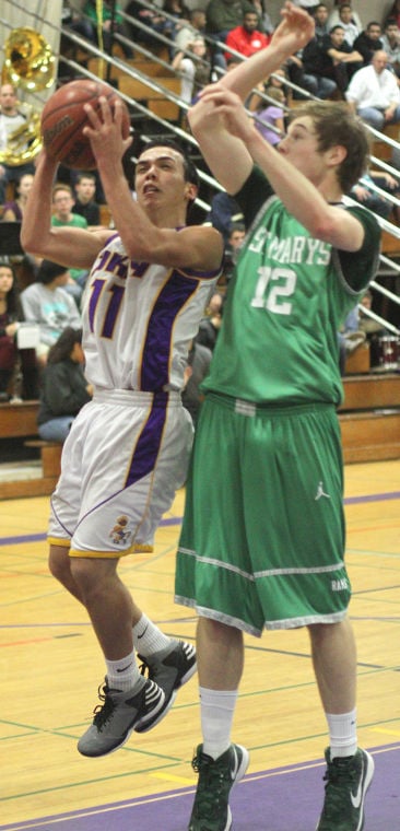 Boys basketball: Tigers hang tough for a half, but Rams pull away 