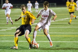 Flames rise to victory in varsity boys soccer playoff opener