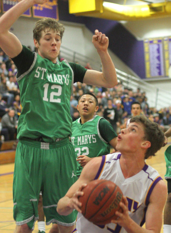 Boys basketball: Tigers hang tough for a half, but Rams pull away