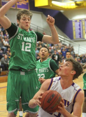 Boys basketball: Tigers hang tough for a half, but Rams pull away