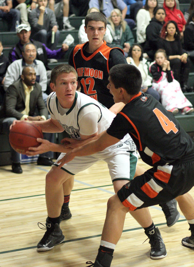 Boys basketball: Hawks hold off Cougars and make history