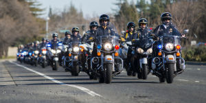 Fallen Galt Police Officer Kevin Tonn Laid To Rest : Dozens of motor officers lead a processional to the graveside service of Galt Police Officer Kevin Tonn on Monday, Jan. 21, 2013.
 - Photo by Dan Evans/News-Sentinel