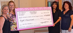 Tiffany Gomes presents donation to Joelle Gomez