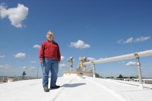 BEA AHBECK/NEWS-SENTINEL White Slough Wastewater Treatment Plant superintendent Karen Honer poses for a picture on top of one of the digesters in Lodi.