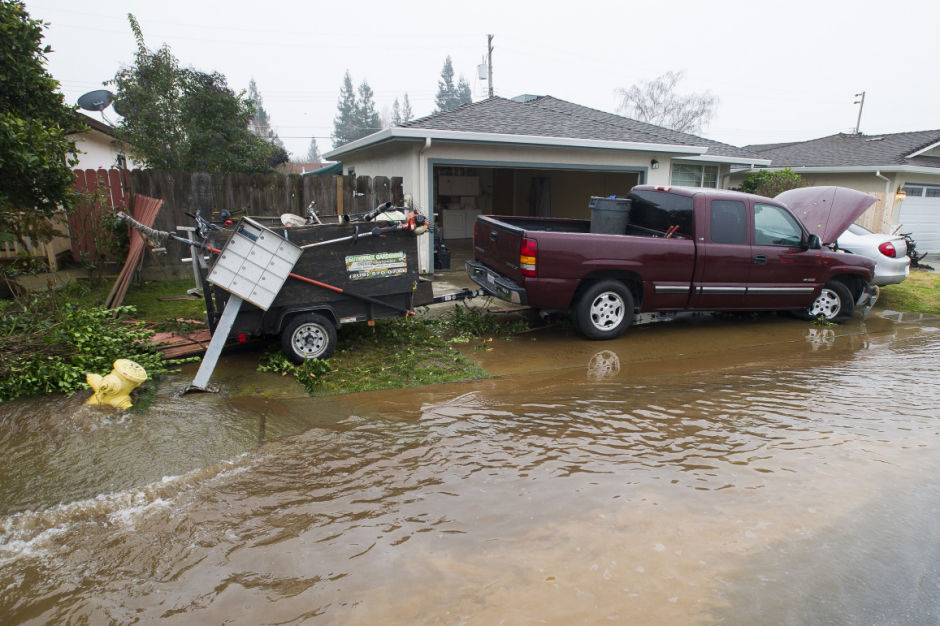 Truck collides with fire hydrant, car