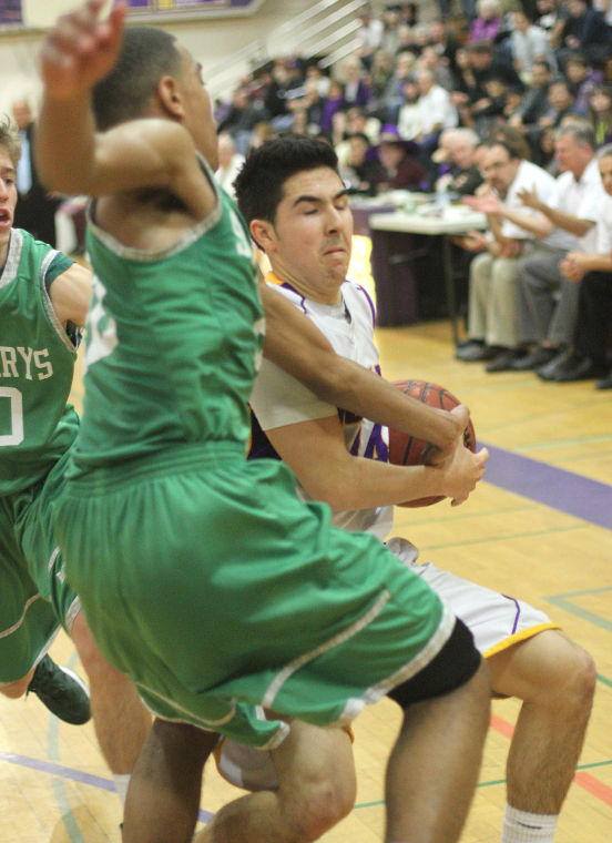 Boys basketball: Tigers hang tough for a half, but Rams pull away 