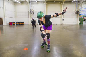 Reporter Skates After Her Derby Girl Dreams : News-Sentinel reporter Sara Jane Pohlman nearly falls while practicing stopping drills during the Port City Roller Girl's practice at the San Joaquin County Fairgrounds on Thursday, Feb. 7, 2013.
 - Photo by Dan Evans/News-Sentinel