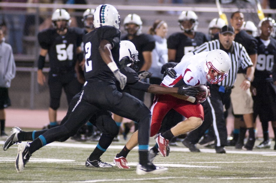 Flames fade late, fall to Huskies in opener 