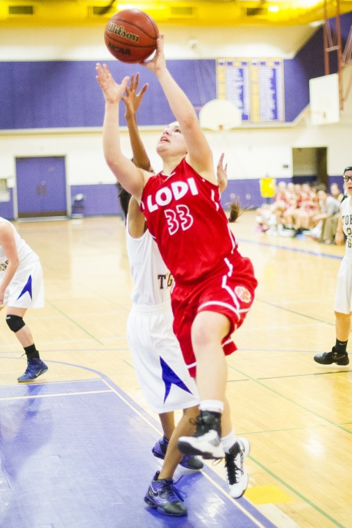 Tigers defeat rival Flames in preseason girls basketball opener 