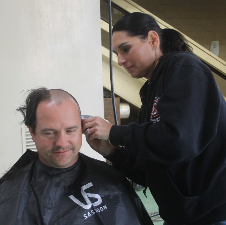 Lodi firefighters shave head to support breast cancer research 