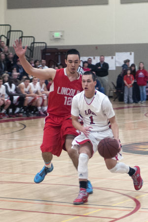 Boys basketball: Flames return to championship form with victory over Trojans 