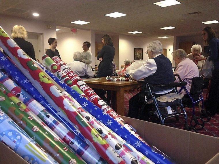 Primrose residents wrap gifts for the homeless