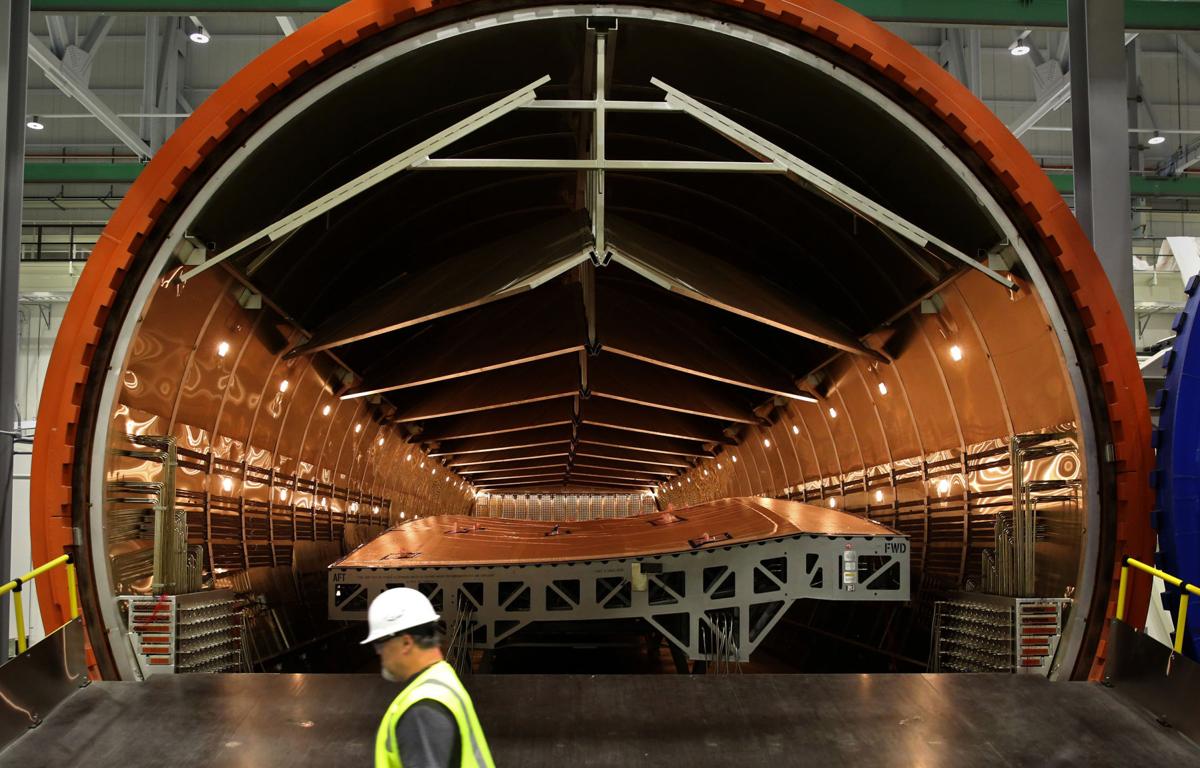 At Boeing’s 777X wing factory, robots get big jobs Local Business