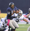 <p>Utah State quarterback Chuckie Keeton (16) carries the ball as Brigham Young defensive lineman Remington Peck, left, and linebacker Kyle Van Noy defend during their game, Friday, Oct. 4, 2013, in Logan, Utah. (AP Photo/The Herald Journal, Eli Lucero)</p>