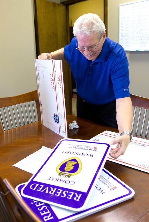 Man Shares Signs Of Respect Purple Heart Parking Spaces