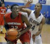 Bloom Township's Nhyree Mitchell applies defensive pressure to Homewood=Flossmoor's Tai Odiase