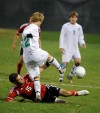 Valparaiso's Luke Kovar, Caleb Neal and Portage's Nathan Johnson