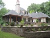 Warmth and worldly flair define a vast riverside estate
