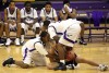 T.F. North senior Deandre Lowery and junior Sylvester Tolliver fight for a loose ball 