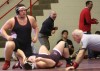 Portage wrestling coach Leroy Vega celebrates a win 
