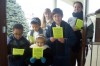 Aquinas School and St. Andrew's join to warm neighborhood through song