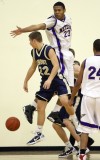 Lemont junior Clayton Tittle passes around the defense