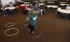 Times reporter Hillary Smith wears the Rascal mascot outfit while running an obstacle course