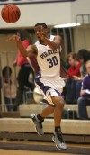 Merrillville's Jamard Owens passes the ball against Portage on Friday.