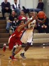 Portage's De'Juan Nelson tries to deflect a pass by Merrillville's B.J. Jenkins on Friday night.