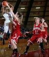 E.C. Central's Dariyelle Ricks shoots against Munster's Jordan Cole