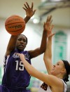 Merrillville's Victoria Gaines is fouled during Saturday's Class 4A Valparaiso Regional championship.