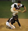 Mount Carmel's Frank Kelly tries to break up a double play