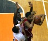East Chicago Central's Lee Epps wraps up a rebound