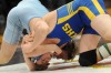 Brandon Bisping of Hanover Central wrestles opponent Eric Johnson