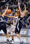 Moore and Dolson lead UConn to Big East title