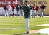 RailCats manager Greg Tagert watches players run through fielding and catching drills