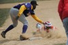 T.F. North first baseman Zachary Turner attempts to tag out 