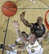 Zack Novak (0) fights for rebound.