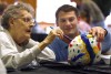 PNC students paint papier-mache eggs with seniors in service project