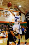 Clark's Jacob Trevino drives for a layup Saturday at Wheeler.