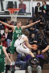 Chesterton's Jacob Andert drives as Valparaiso's John Mosser defends in the first half of Friday night's semifinal of the Class 4A Michigan City Sectional.