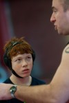 Freshman wrestler Giovanni Phan listens