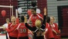 T.F. South volleyball players celebrate