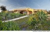 OFFBEAT: Dick Clark's 'Flintstones' house in Malibu on the market