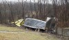 Semi stuck in trees over Trail Creek