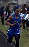 Crete-Monee's Aki Allen runs in the 800 meter relay