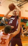 Hanover Central's Maxwell Johnson gets tangled up with Wheeler's Kevin Barnes