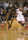 Bowman's Davon Dillard is guarded by E.C. Central's Martayveus Carter on Tuesday.