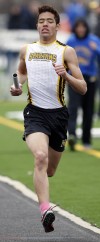 Marian Catholic's Cameron Howard runs in the 3,200-meter relay