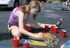 Kids paint the parking lot at Crete Library